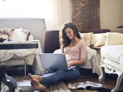 Smiling Woman on Laptop in Wichita, KS